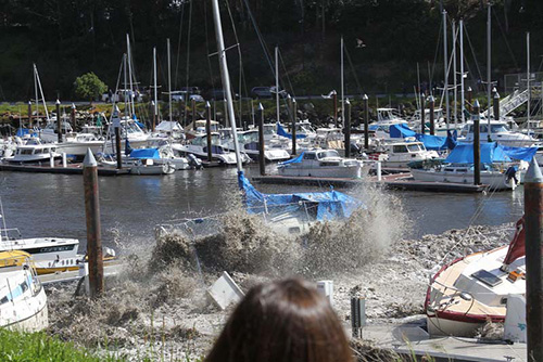 The March 11, 2011 tsunami wave hits the Santa Cruz Harbor. Photo by Eileen Sundet. Harbor Collection. Courtesy of the Santa Cruz Port District.