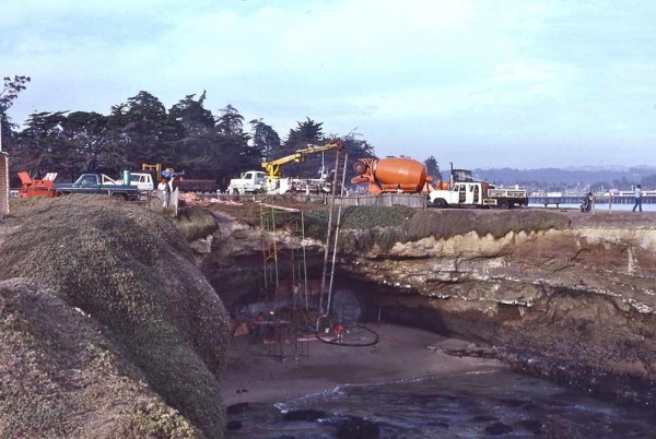 Filling the caves under Lighthouse Point in 1980. Photo by and courtesy of Frank Perry.