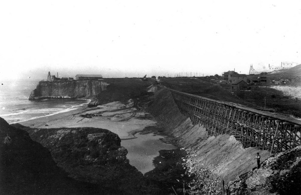 This 1906 photo shows the wooden railroad trestle that crosses San Vincente Creek, at Davenport, partially filled in. There are many of these filled trestles between Davenport and Santa Cruz, including the one at Bonny Doon Beach. Photo from the collection of Gary Griggs and courtesy of Sandy Lydon.