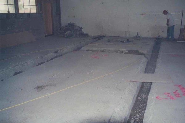The drains that ran in the concrete floor exposed during the 2002 remodel. Photo courtesy of Mark and Kelly Sanchez.