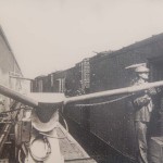 Ice being blown onto the top of vegetable crates inside railroad cars circa 1950s.