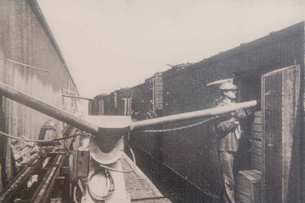 Ice being blown onto the top of vegetable crates inside railroad cars circa 1950s.