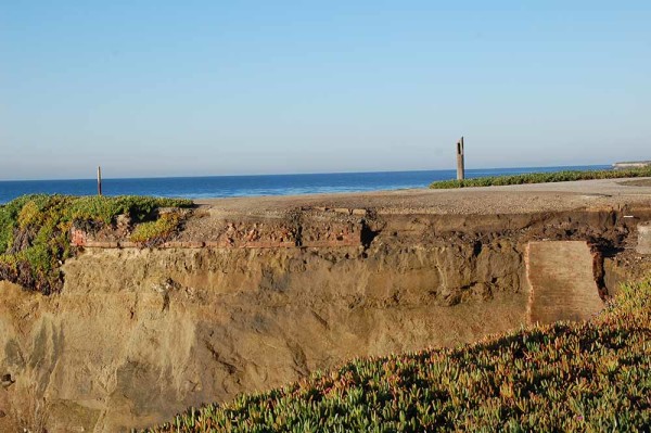 Brick remnants of the original 1869 lighthouse (center left). The round brick thing (center right) was a cistern used for collecting rainwater from the lighthouse roof. These can be seen in the cliff edge in the cove to the east of the "Don't Be Next" sign.