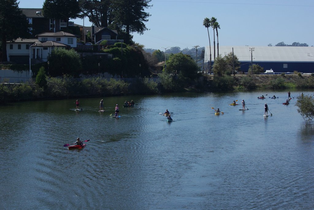 Stand up paddle-boarders, kayakers, and canoeists enjoy the San Lorenzo River for the first time in decades from their watercraft. Photo taken in October 2013 from the Riverside bridge. Picture courtesy of and copyright Melissa Foley.
