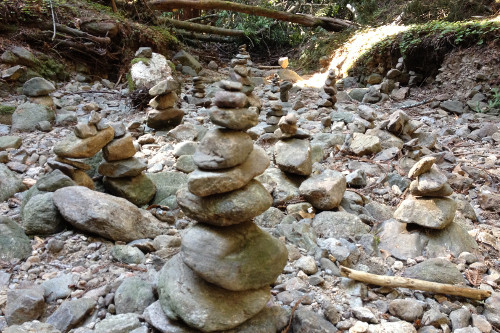 When lacking flow, this water-less river bed creates an opportunity for students of UC Santa Cruz and artists alike to display their best rock balancing art. Photo © Lauren McEvoy