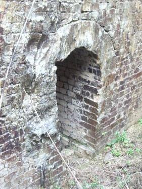 The kilns are lined with fire-bricks, which have partly melted from the intense heat. Company names stamped on the bricks indicate that they were imported from northern England. Photo courtesy of the Friends of the Cowell Lime Works Historic District.