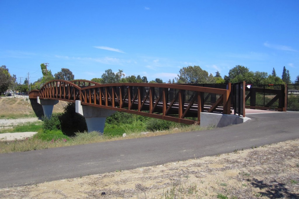 The highway 1 pedestrian bridge connects the east and west banks of the San Lorenzo River at the northernmost point of the Santa Cruz Riverwalk. Photo courtesy and © of Mark Yashinsky.