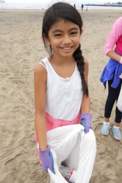 Two young participants in a clean-up event at Seabright Beach. Photo courtesy of Save Our Shores.