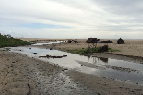 Pilkington Creek spilling out onto Seabright Beach after a winter storm. Photo courtesy of Molly Lautamo.
