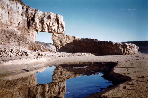 Doon Beach with its natural bridge circa 1975. Photo: From the collection of Paul and Carmen Mulholand via Tom Scully